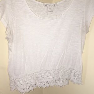 White tee with crotchet detail on the bottom